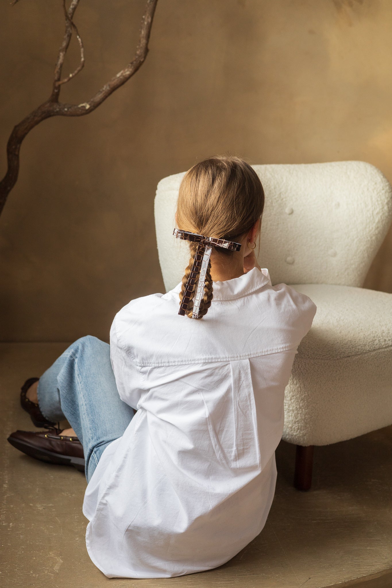 Vegan leather bow on a gold-plated clip