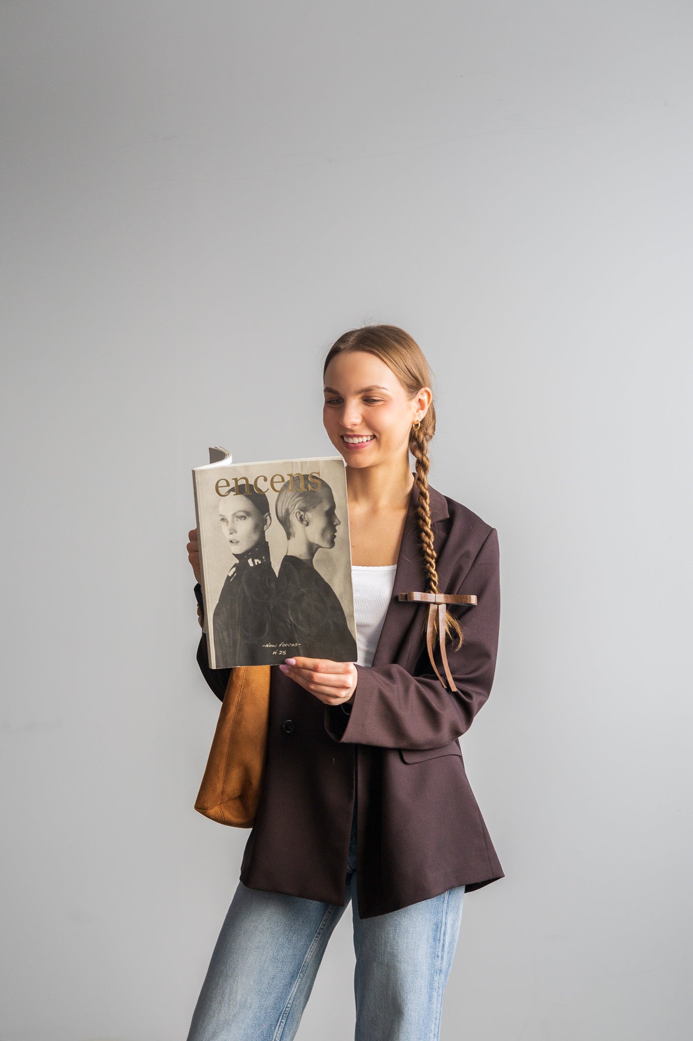 Vegan leather bow on a gold-plated clip