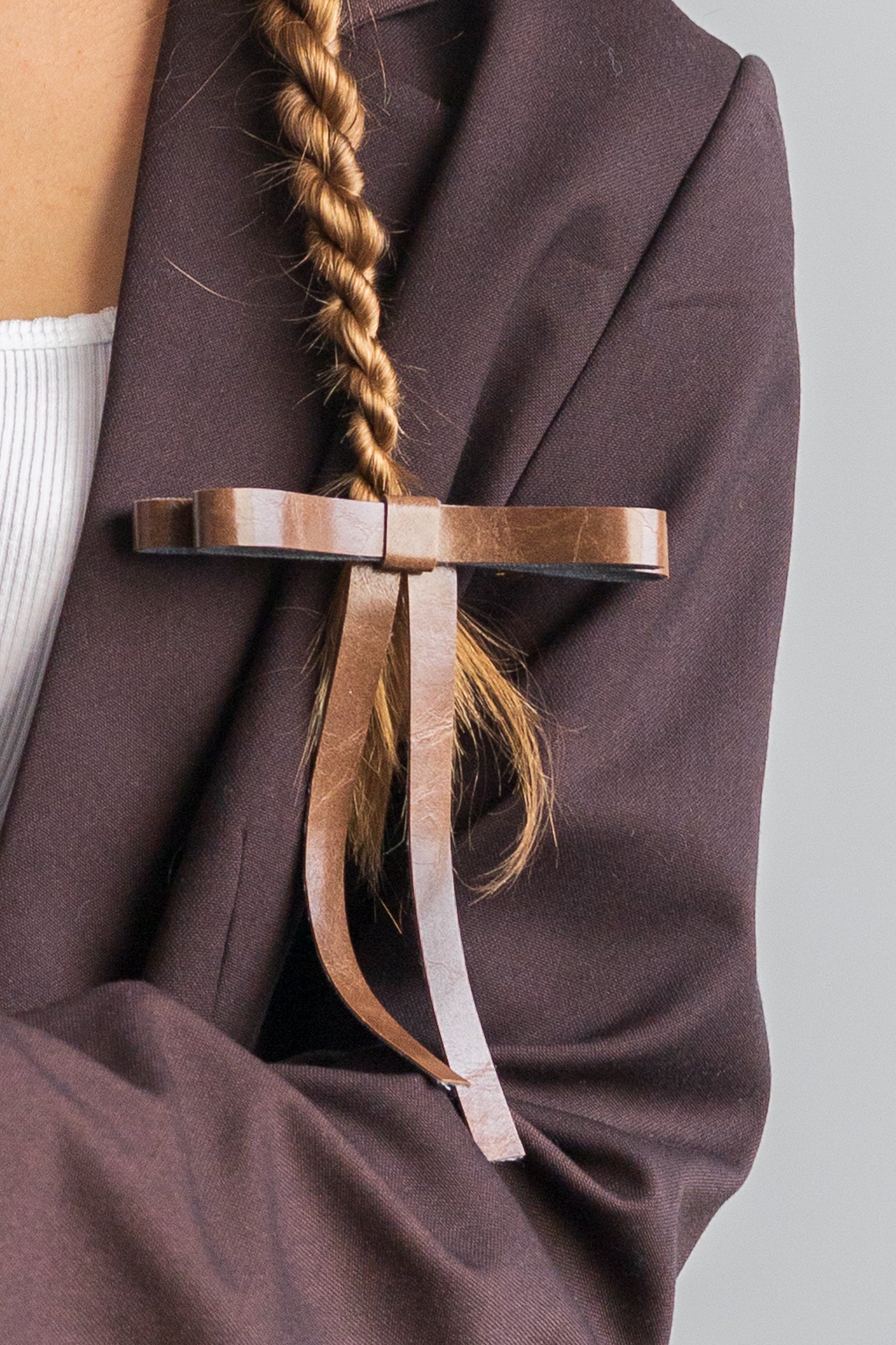 Vegan leather bow on a gold-plated clip