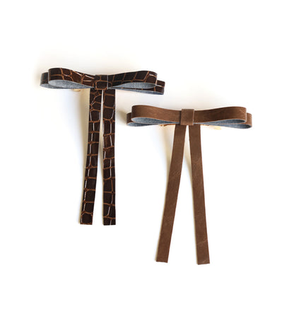 Vegan leather bow on a gold-plated clip