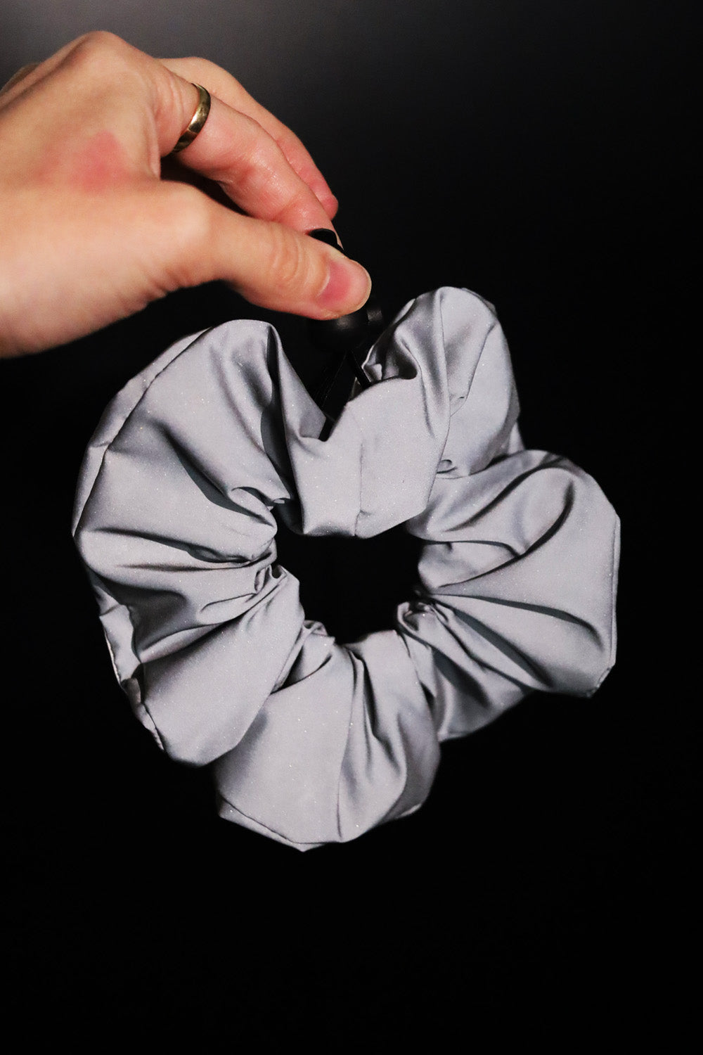 Reflective sports scrunchie with a secure hold