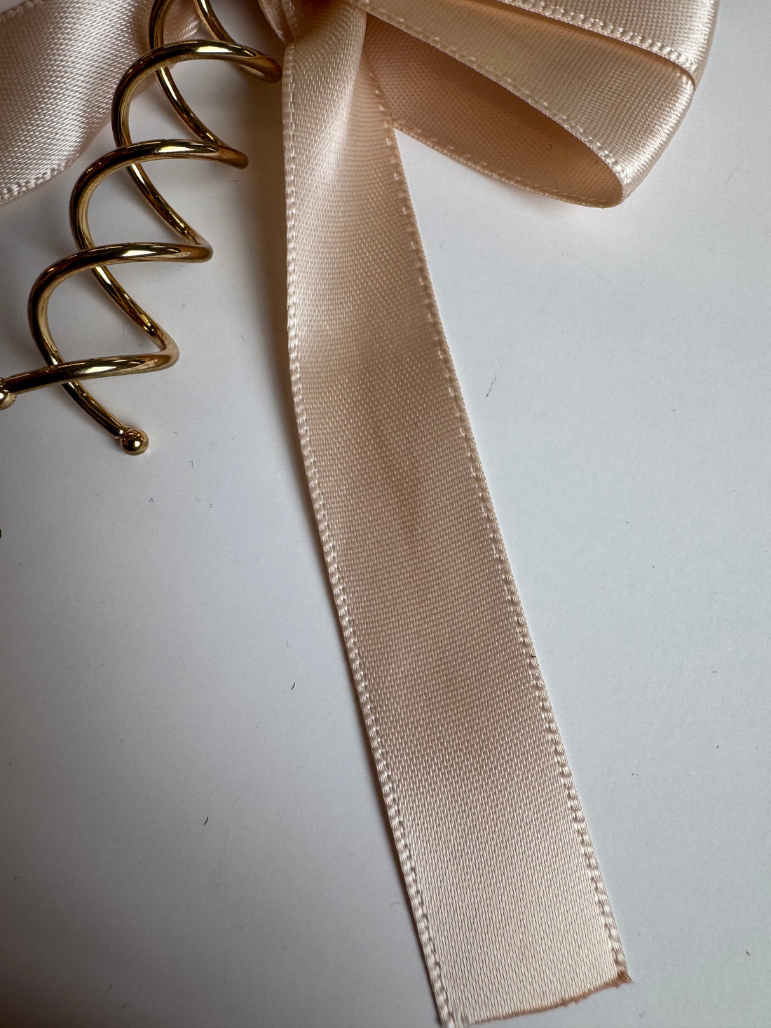 Imparfait - Boucle sur spirale en rosé